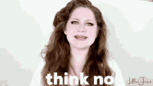 a woman with long hair says think no