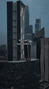 a city skyline with the words welcome to saudi arabia at the bottom