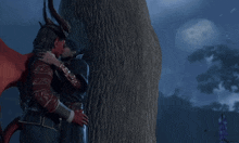 a man with horns is kissing another man