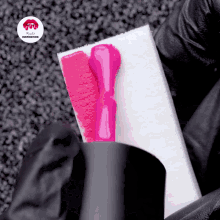 a pink nail polish is being applied to a sponge with lipstick inspiration written in the corner
