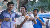 three men are standing next to each other with a no smoking sign in the background