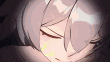 a close up of a girl 's face with her eyes closed in a dark room .