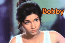 a close up of a woman 's face with the word bobby written above her