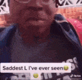a close up of a person 's face with a caption that says `` saddest l i 've ever seen ''