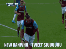 a soccer player is laying on the field with the words new danwhu tweet siiuuuuu written below him