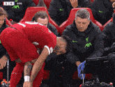 a man in a red shirt with the number 10 on the back