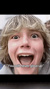 a young boy with a surprised look on his face and the words " you will never glow up "