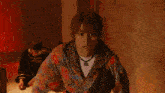 a pixelated image of a person with a necklace that says ' i love you ' on it