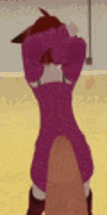 a cartoon character in a pink sweater is standing on a yellow floor with his hands behind his head .