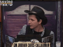 a man in a cowboy hat is sitting at a table with a sign that says gm jordan caves callarman