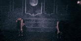 a blurry image of two women dancing in a dark room