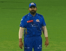 a man wearing a blue shirt with a cash logo on it