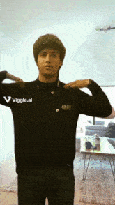 a man wearing a black shirt with a logo on it that says " viggle.ai "