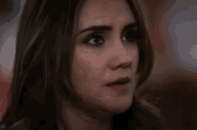 a close up of a woman 's face with a red lip