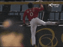 a baseball player in a red jersey with the number 0 on it