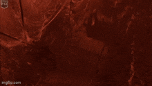 a red background with the words get down here written in white