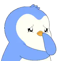 a blue and white penguin with a sad look on it 's face