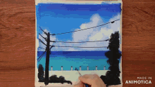a person is painting a picture of the ocean with the words made in animotica below it
