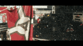 a red and white flag with the word papa on it is flying in the wind