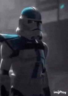 a close up of a storm trooper from star wars standing in a room .
