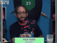 a man named rick budd is sitting at a desk
