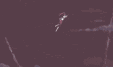 a woman with red hair is flying through the air in a fairy tail anime .