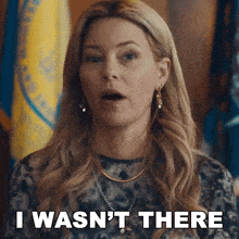 a woman says i wasn 't there in front of a flag