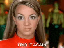britney spears is wearing a red jumpsuit and says i did it again .