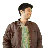a man wearing a brown jacket and a green t-shirt with the letters e and o on it