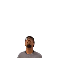 a man with a beard and glasses looks up at the number 27