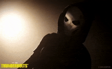 a poster for thunderbolts shows a person wearing a white mask