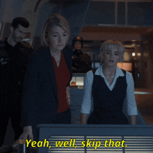 two women standing next to each other with yeah well skip that written on the screen