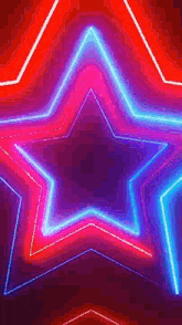 a red , purple , and blue neon star on a dark background