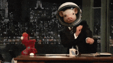 a man in a suit and tie with a pig on his head and a mug that says ' washington post ' on it