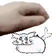 a hand is reaching out towards a cartoon cat laying on its back .