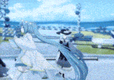 two anime girls are dancing on a stage in front of a beach .