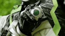 a close up of a person 's arm with a green eye