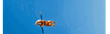 a blurred image of a helicopter flying in the sky