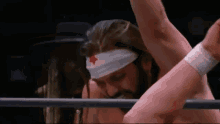 a wrestler with a red star on his headband