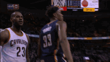 a basketball player wearing a jersey with the number 23 on it