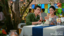 a couple sitting at a table with a star plus logo on the bottom right