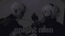 a couple of people standing next to each other with the words `` gnight man '' written on the bottom of the image .