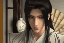 a man with long black hair is standing next to a fan and a vase
