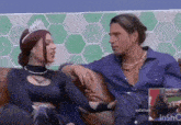 a man and a woman are sitting next to each other on a couch .