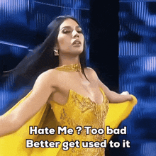 a woman in a yellow dress with the words hate me too bad better get used to it below her