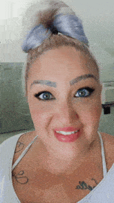 a woman with a tattoo on her chest that says " i love you "