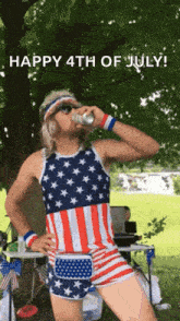a man in an american flag outfit drinks a beer