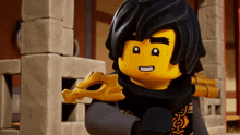 a lego character holding a gold dragon skull on his shoulder