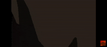 a black object with a red light coming out of it