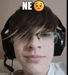 a young man wearing glasses and headphones has a sad face above his head that says " ne "